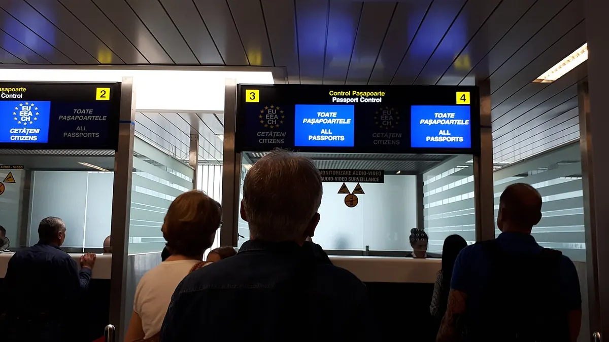 Travellers queuing at airport passport control Travellers queuing at airport passport control, where nationality decides the visa an Indian passport holder needs